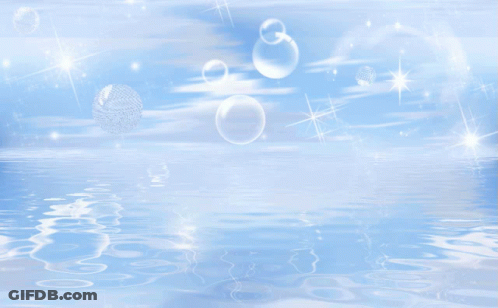 Soap Bubbles Are Floating In A Blue Sky Above A Body Of Water GIF