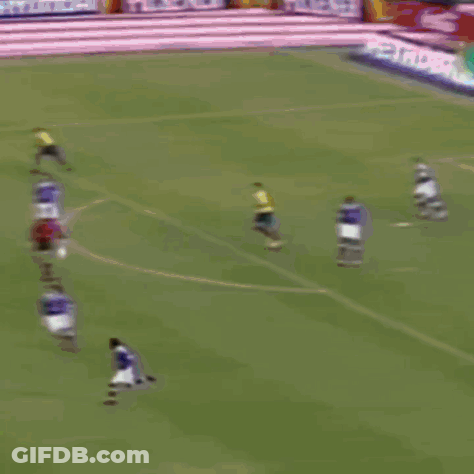 Soccer Game In Front Of Coca Cola Ad GIF