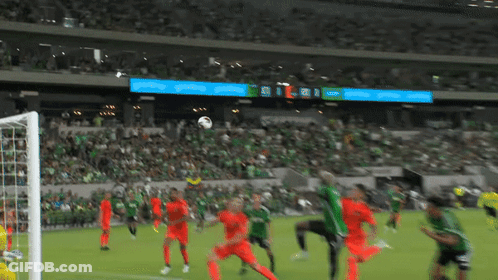 Soccer Game In Front Of Crowd With Coca Cola Scoreboard GIF