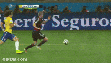 Soccer Game In Front Of Entauro.com Sign GIF