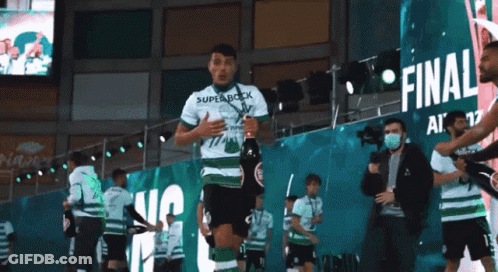 Soccer Game In Front Of Exporlux Banner GIF