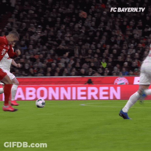 Soccer Game In Front Of FC Bayern.tv Sign GIF