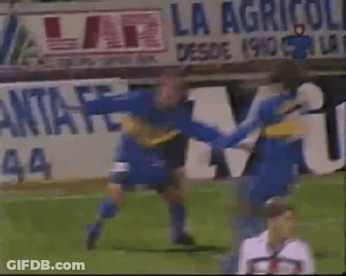 Soccer Game In Front Of La Agricola Sign GIF
