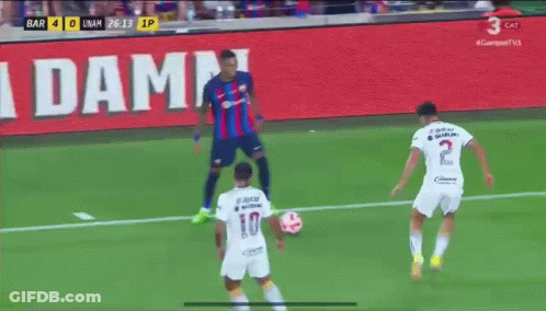 Soccer Game In Front Of La Damm Sign GIF