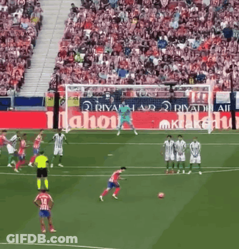 Soccer Game In Front Of Large Mahou Ad GIF