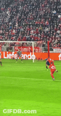 Soccer Game In Front Of Lieferando Banner GIF