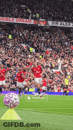 Soccer Game In Front Of Sir Alex Sign GIF