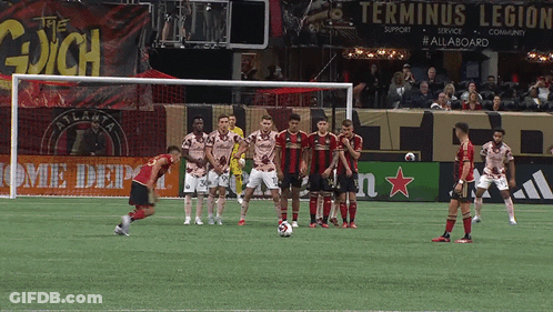 Soccer Game In Front Of Terminus Legion Sign GIF