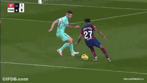 Soccer Game In Front Of Tonic Foot Wall GIF