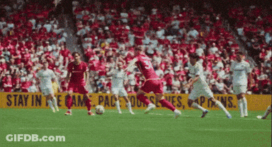 Soccer Game In Front Of Yellow Stay In The Game Sign GIF