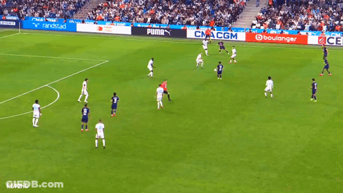 Soccer Game On Field With Puma And Boulangerie Ads GIF