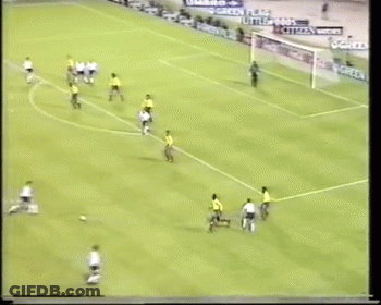 Soccer Game With Advertisements On Fence GIF