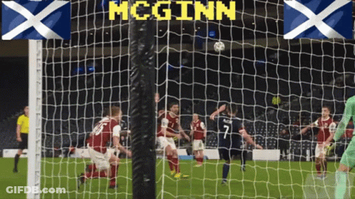 Soccer Game With McGinn Above Net GIF
