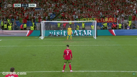 Soccer Game With Visit Qatar Ad Behind Goal GIF
