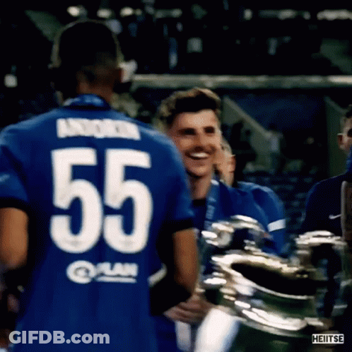 Soccer Player 55 Hugging Teammate With Trophy GIF