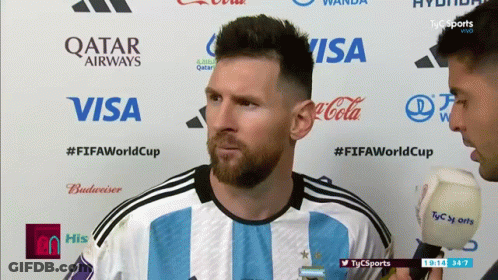 Soccer Player And Reporter With Qatar Airways Visa Coca-Cola Logos GIF