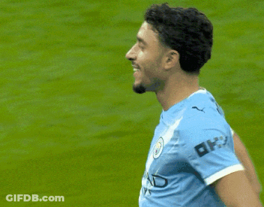 Soccer Player Blue Shirt With OK On Sleeve GIF