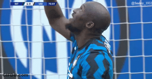 Soccer Player Catching Ball In Blue Black Jersey GIF
