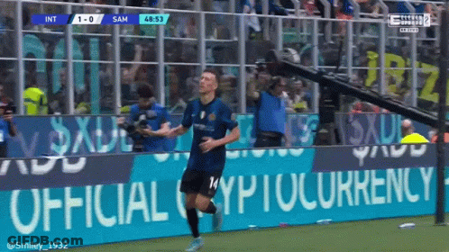 Soccer Player Celebrates Goal Before Cryptocurrency Banner GIF
