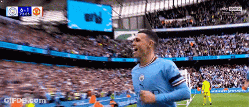 Soccer Player Celebrating Goal In Front Of Crowd GIF