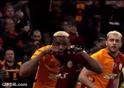 Soccer Player Celebrating Goal In Front Of Fans GIF