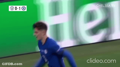 Soccer Player Celebrating Goal In Front Of Heineken Ad GIF