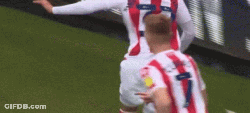 Soccer Player Celebrating Goal In Red And White Striped Jersey GIF