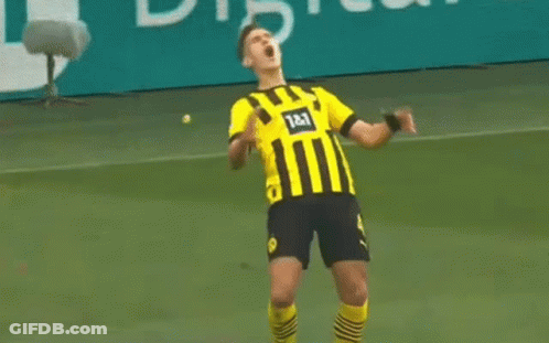 Soccer Player Celebrating Goal In Yellow And Black Striped Shirt GIF
