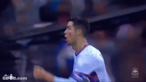 Soccer Player Celebrating Goal With Fist In Air GIF
