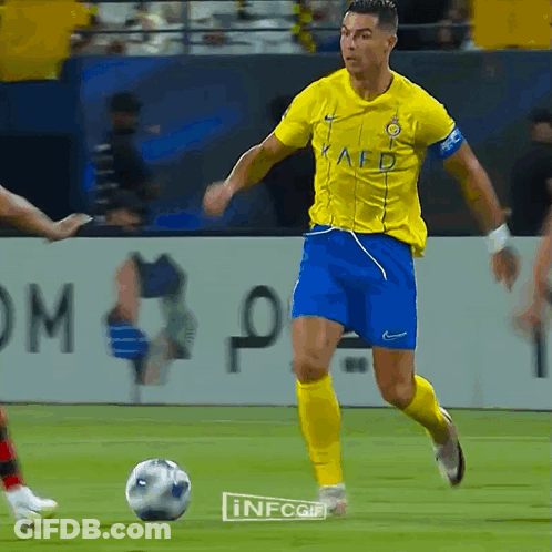Soccer Player Dribbling Yellow Kaed Jersey Blue Shorts GIF