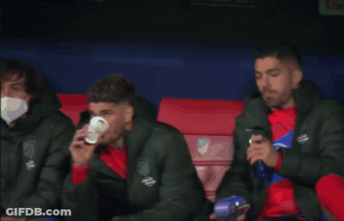 Soccer Player Drinking Cup On Bench GIF