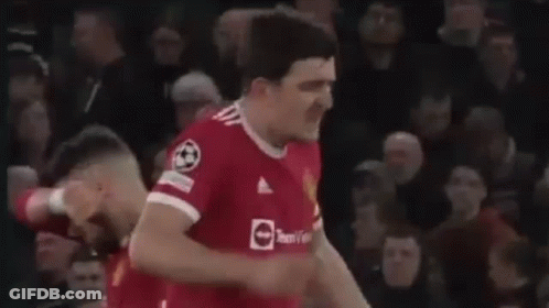 Soccer Player Giving Fist Bump In Front Of Crowd GIF