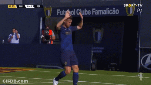 Soccer Player High Fiving By Ventilation Sign GIF