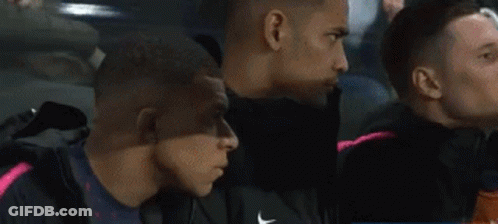 Soccer Player Holding Ball In Front Of Face GIF