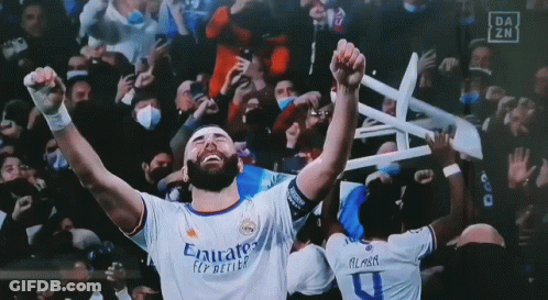 Soccer Player Holding Chair Over Head In Emirates Shirt GIF