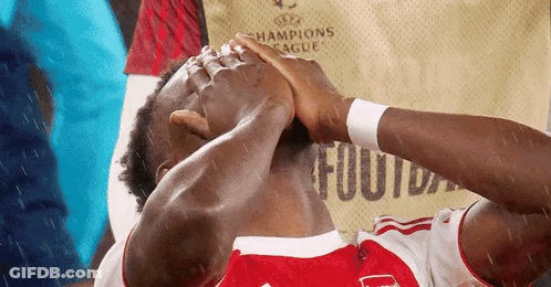 Soccer Player Holding Head In Champions League Jersey GIF