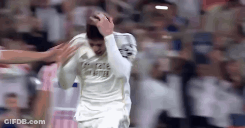 Soccer Player Holding Head In Pain GIF