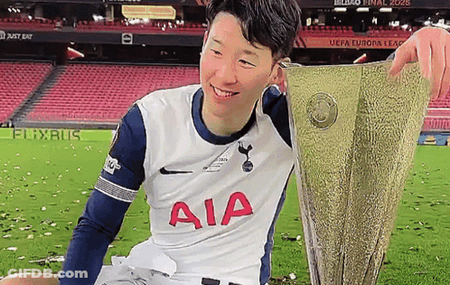 Soccer Player Holding Trophy GIF