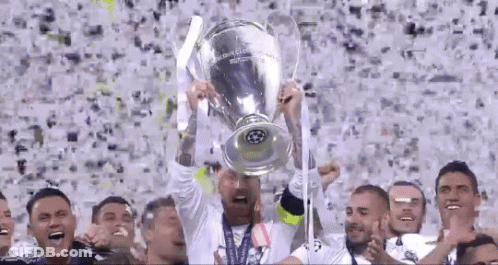 Soccer Player Holding Trophy In Front Of Crowd GIF