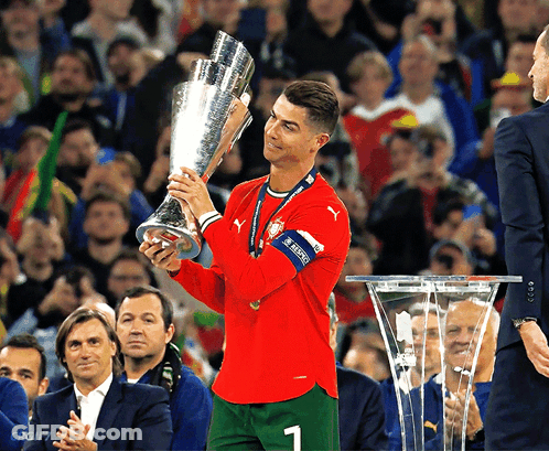 Soccer Player Holding Trophy Number 1 GIF