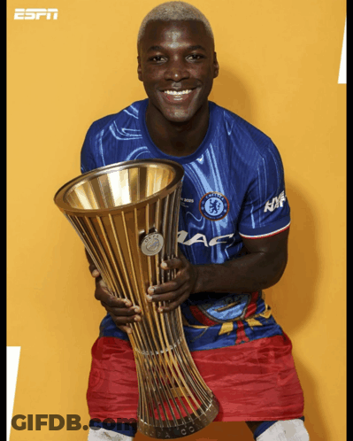 Soccer Player Holding Trophy That Says ESPN GIF