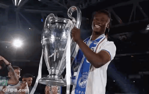 Soccer Player Holding Trophy With Blue Scarf GIF