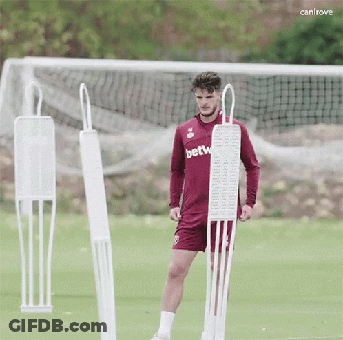 Soccer Player In Betw Jersey Next To Mannequin GIF