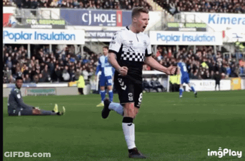 Soccer Player In Black And White Checkered Jersey Celebrating GIF