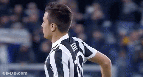 Soccer Player In Black And White Striped Jersey Standing On Field GIF