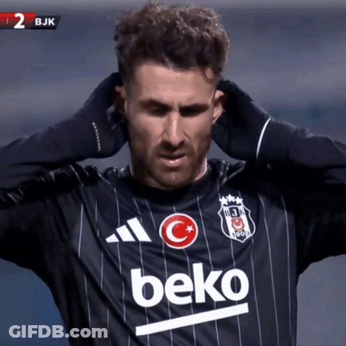 Soccer Player In Black Beko Jersey Holding Head GIF
