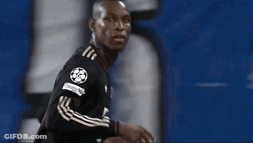 Soccer Player In Black Jersey With Number 8 On Sleeve GIF