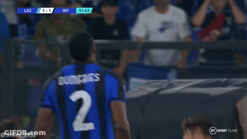 Soccer Player In Blue And Black Jersey Before Scoreboard GIF
