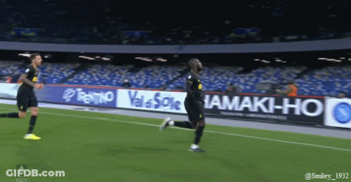 Soccer Player In Blue And Black Jersey Catching Ball GIF