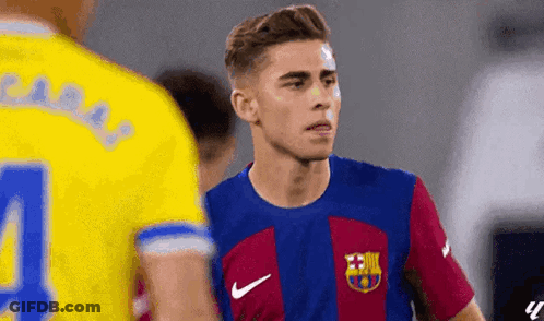 Soccer Player In Blue And Gold Jersey Number 4 GIF